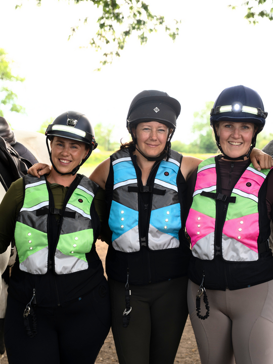 EquiLight Pro Rider Vest with integrated rechargeable LED lighting and hi-vis reflective detailing, designed to be compatible with air vests and improve rider visibility and safety in low-light conditions
