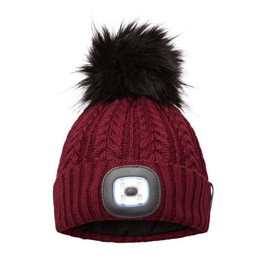 EquiLight Merino LED Pom Beanie with rechargeable hands-free LED light for outdoor visibility, Merino wool pom beanie with integrated rechargeable LED light by EquiLight, Person wearing EquiLight merino LED pom beanie for hands-free lighting outdoors, Close-up of integrated LED light on EquiLight merino pom beanie, Soft merino wool pom beanie with built-in LED light designed for warmth and comfort