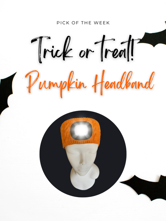 Bright orange EquiLight Pumpkin LED Headband glowing at dusk – rechargeable hi-vis safety light for Halloween riding, running and walking