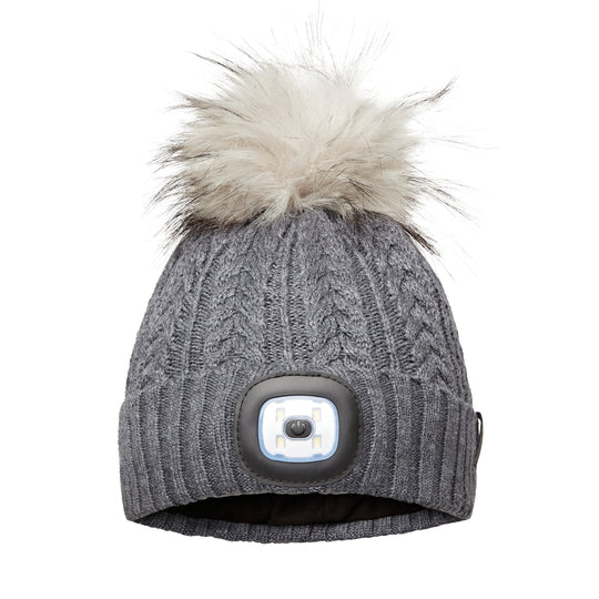 EquiLight Merino LED Pom Beanie with rechargeable hands-free LED light for outdoor visibility, Merino wool pom beanie with integrated rechargeable LED light by EquiLight, Person wearing EquiLight merino LED pom beanie for hands-free lighting outdoors, Close-up of integrated LED light on EquiLight merino pom beanie, Soft merino wool pom beanie with built-in LED light designed for warmth and comfort