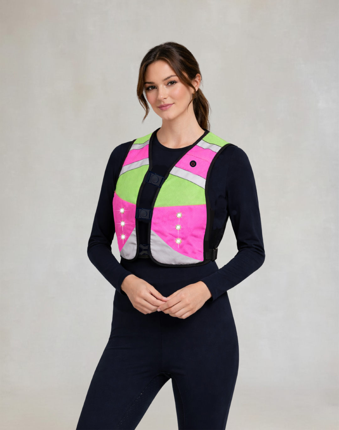 EquiLight LED hi-vis equestrian vest front view, pink and lime reflective riding vest with integrated lights